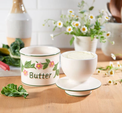 Smørkrukke med vand, blomster
