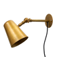 Vala Flex væglampe i rå messing fra H. Skjalm P. Design: H. Skjalm P.